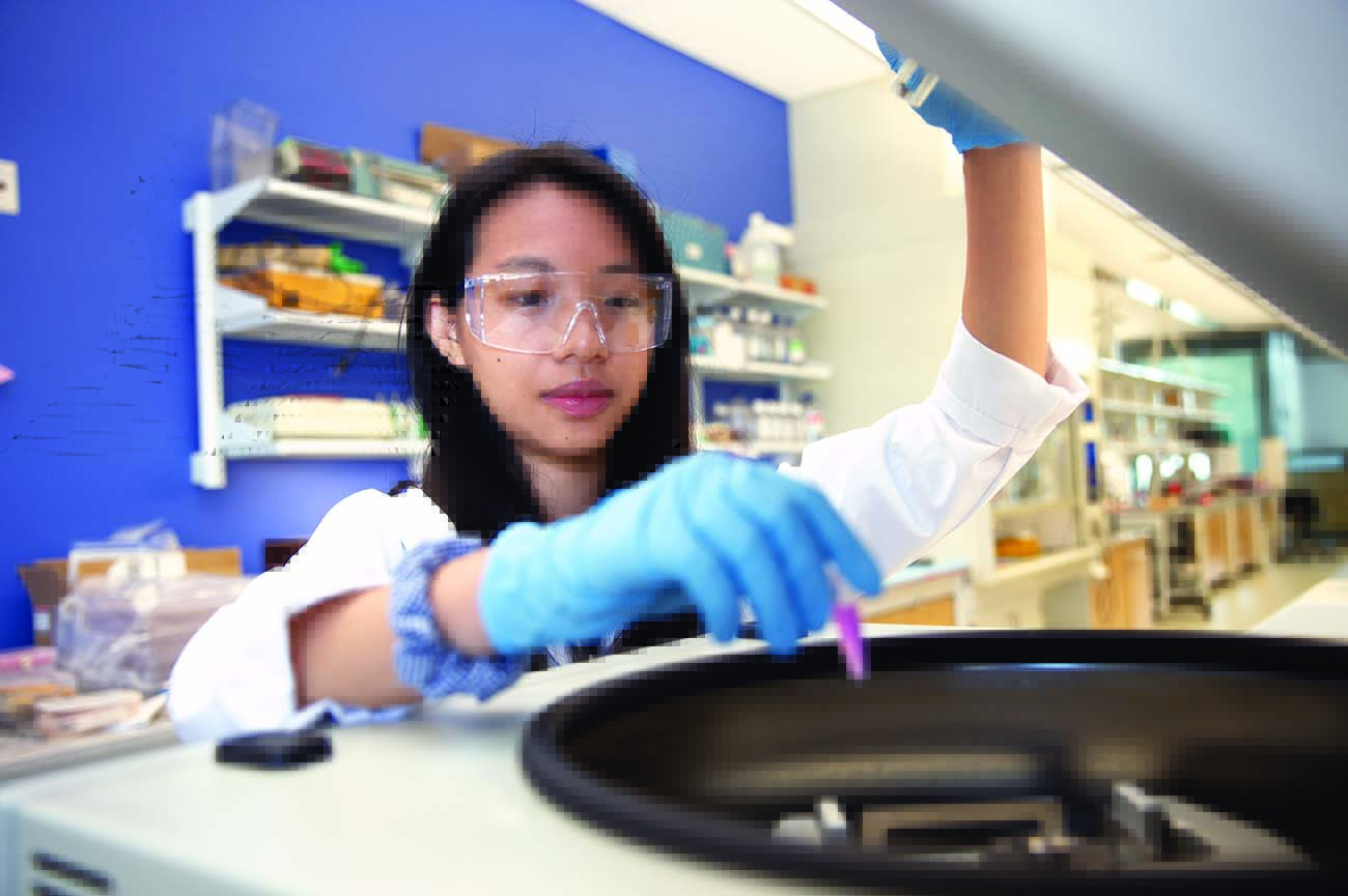 Sally Wang working in a lab